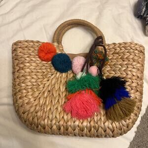 Cream and tan straw beach bag with pompoms